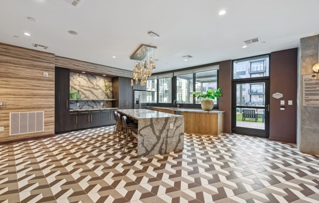 the lobby of a hotel with a marble bar and a checkered floor at Link Apartments® Broad Ave, Memphis, Tennessee