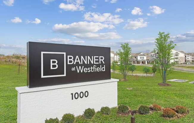 A sign for Banner at Westfield with a large B on it.