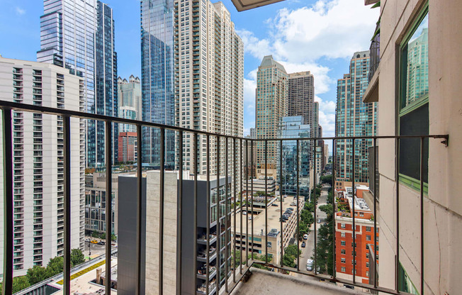 a balcony with a view of the city and skyscrapers