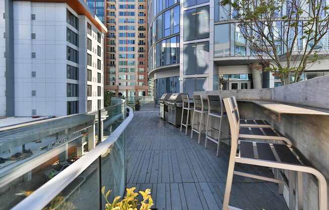 A long wooden walkway with metal railings and benches on either side.