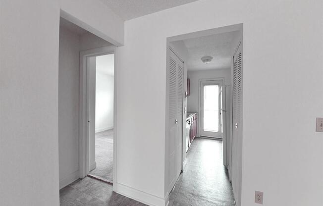 View of Renovated apartment with white alls and grey flooring Apartment at Silvertree Apartments