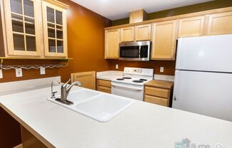 Bright & Spacious 2-Bedroom End Unit Townhome in Desirable Woodstock Neighborhood!