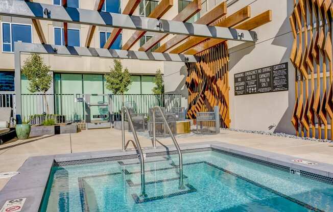 A pool with a slide and a sign that says "No Diving".