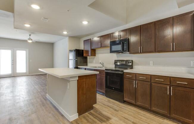 Wood Floor Kitchen at Aviator at Brooks  Apartments, Clear Property Management, San Antonio, TX