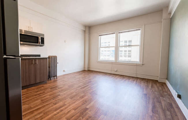 Seattle Apartments - Addison on Fourth Apartments - Living Room and Kitchen at Addison on Fourth, Seattle, Washington