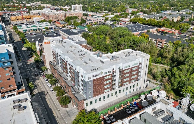 a view from above of a large white building with a red brick facade