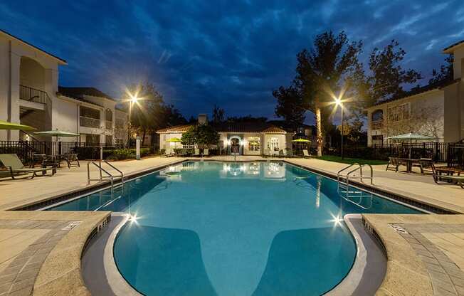 Community Swimming Pool with Pool Furniture at Vinings at Hunter's Green Apartments in Tampa, FL.