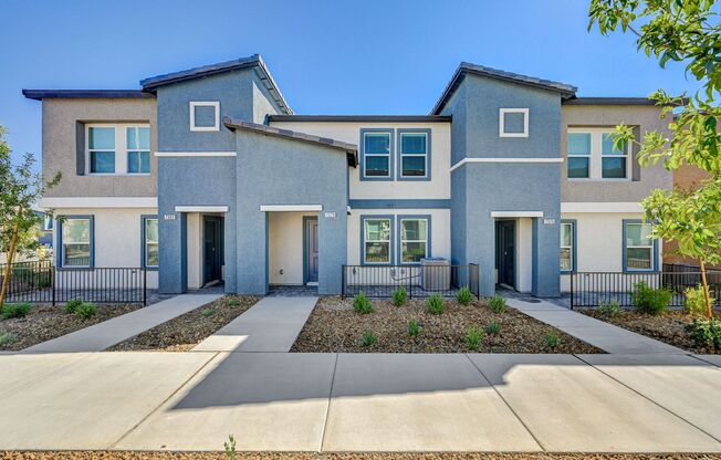 Adorable BRAND NEW three bedroom townhome with a 2 car garage in Tule Springs!
