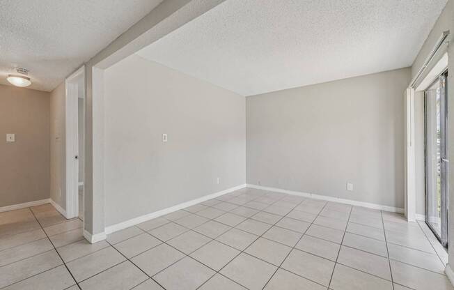 A room with a white tile floor and walls.
