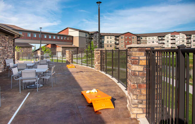 Outdoor Patio with Tables and Cornhole