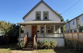 Charming 1907 house with stunning front porch and spacious back yard!