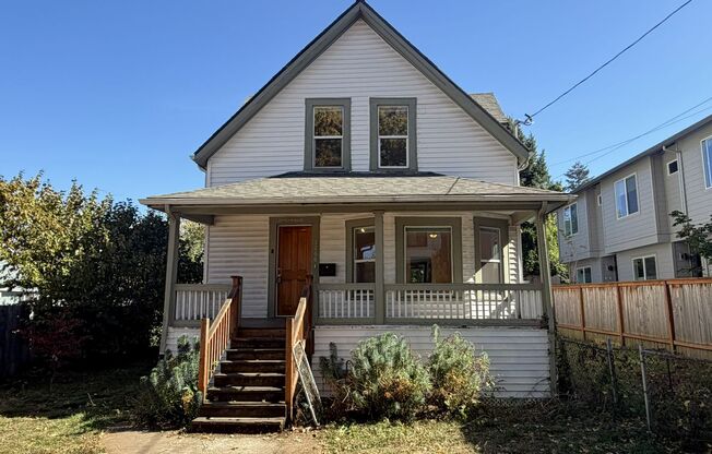 Charming 1907 house with stunning front porch and spacious back yard!