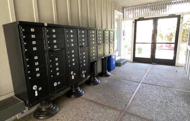 a view of the inside of a building with a row of cabinets on the floor