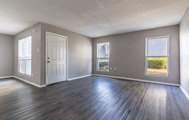 Whitney Manor Apartments in Gretna, LA photo of living room with hardwood floors