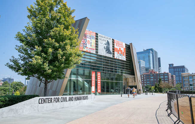 The Center for Civil and Human Rights building has a tree in front of it.