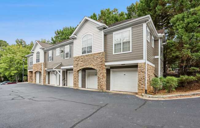 A two-story house with a garage on the ground floor.