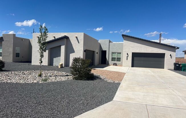 Newer FIVE BEDROOM / FOUR BATHROOM / FOUR CAR GARAGE