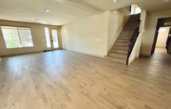 Stunning 4 bedroom 3.5 bath home with a 3 car garage! Home features many rare upgrades including real hardwood flooring, a wood framed shed, a large openable canopy, and pavers & turf! All windows have sun shades instead of blinds! All bedrooms have walk