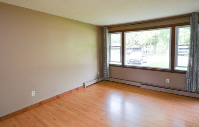 Two Bedroom Apartment with Exclusive Driveway and Garage Located In NE Rochester!