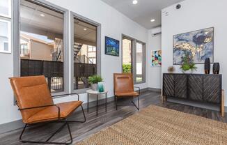 a living room filled with furniture and a large window