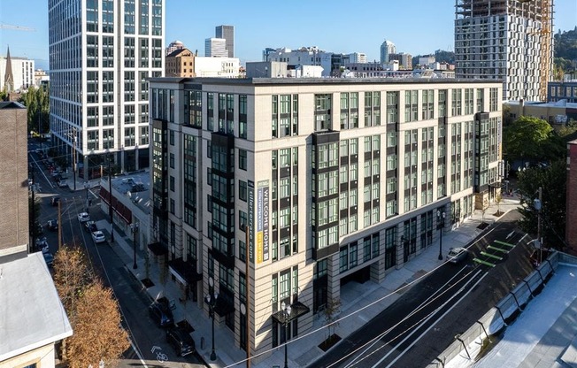 an aerial view of a large white building in the city