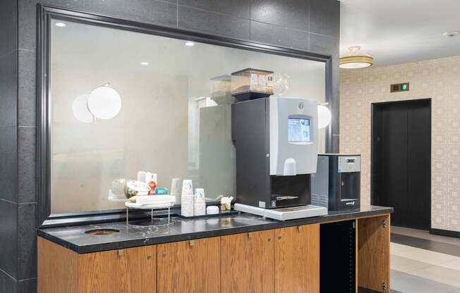 a coffee maker sitting on a counter in a hotel room