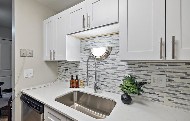 Kitchen with cabinets at Town & Country Apartments - Wixom, MI, Wixom, 48393