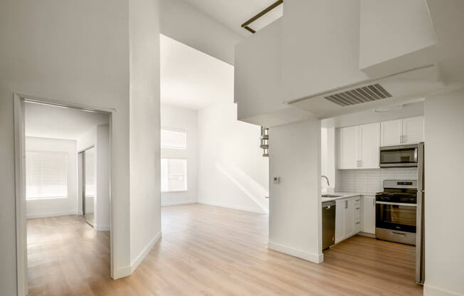 A kitchen with a stove top oven and a microwave.