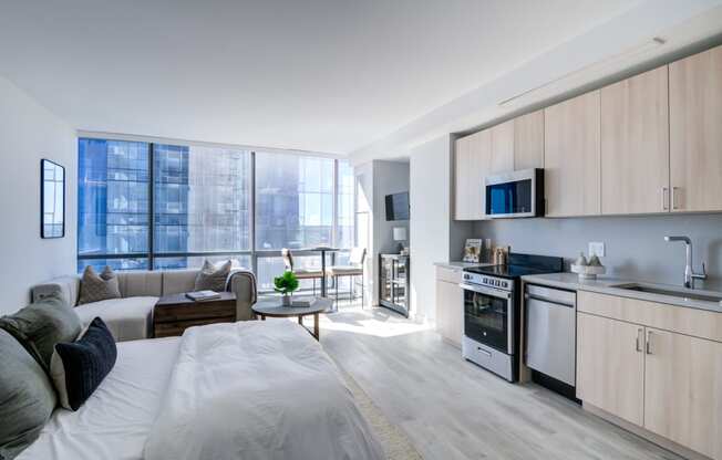 a living room with a couch and a kitchen in a apartment