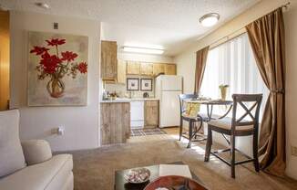Living room and dining at Comancge Wells Apartments in Albuquerque NM October 2020