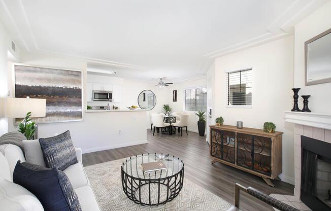 a living room filled with furniture and a large window