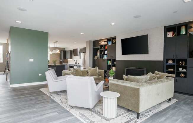 a living room with a couch and chairs and a television