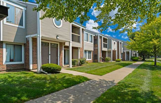 Private-Entry apartment buildings in Southfield with a walkway and sidewalk.