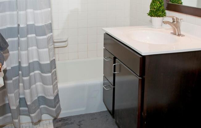 White Tile Bathroom with Large Tub and Shower at 2800 Girard Apartments in Minneapolis, MN