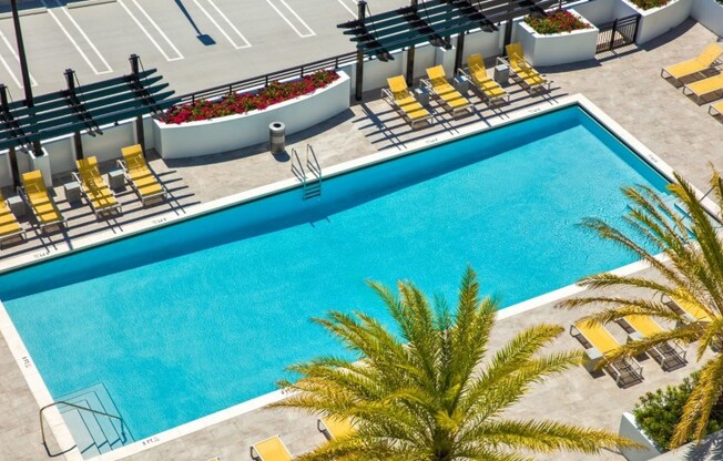 Pool outside apartments for rent in Miami.