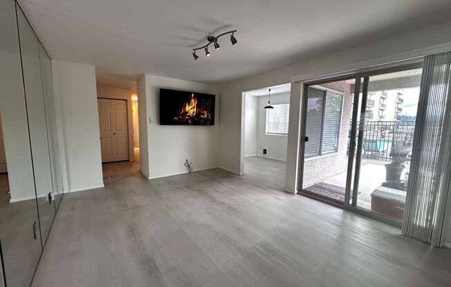 Updated 2-Bedroom Condo with Water Views, 2 Parking Spaces & Poolside Location