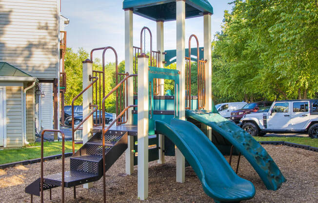 a playground with slides and a climb up