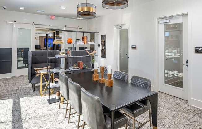 Icon at Cooley Station-Clubhouse with large table black table and chairs and a kitchen for events