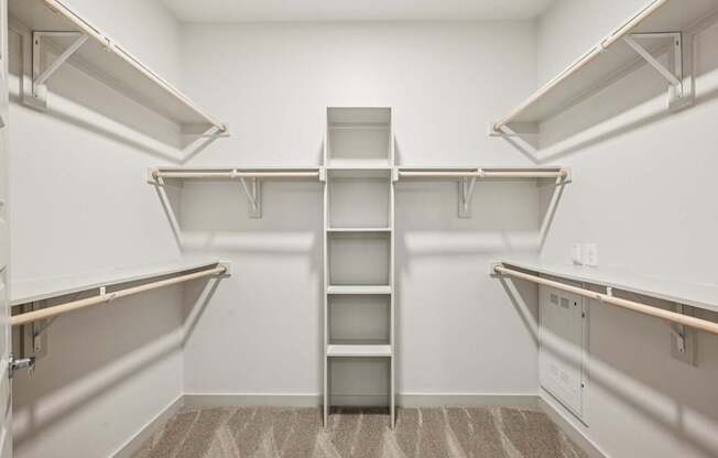 Empty white shelves in a room.