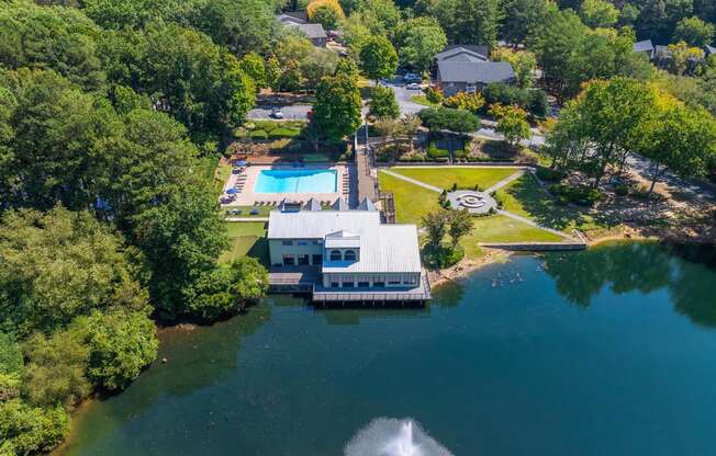 an aerial view of a house on the water