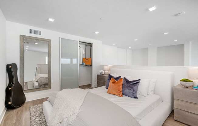 Lofts for Rent Woodland Hills, CA - The Q Variel - Loft Bedroom with a Closet and Luxury Wood Plank Style Flooring