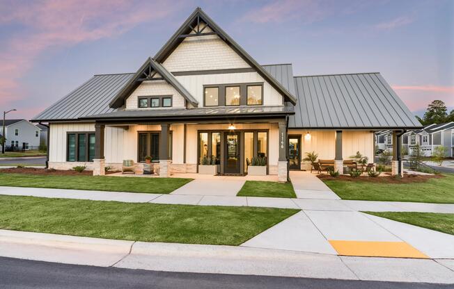 The resident clubhouse showcases farmhouse-inspired architecture, inviting gathering spaces, and thoughtfully designed indoor-outdoor amenities that serve as the heart of the community.