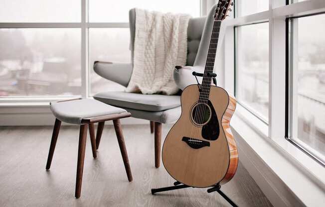 staged decor close up: chair and guitar