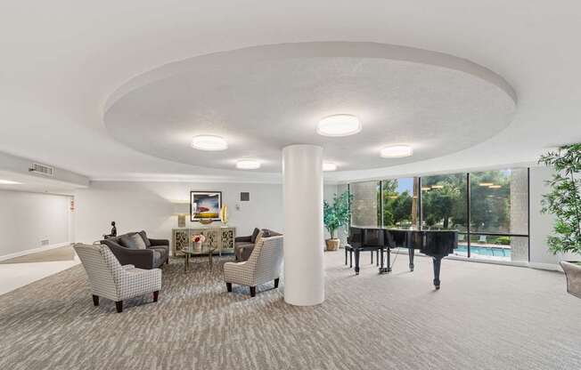 A room with a piano and chairs at Hampton Apartments, Clearwater, Florida