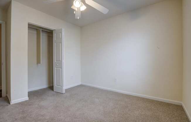 Living room and carpet with ceiling fan