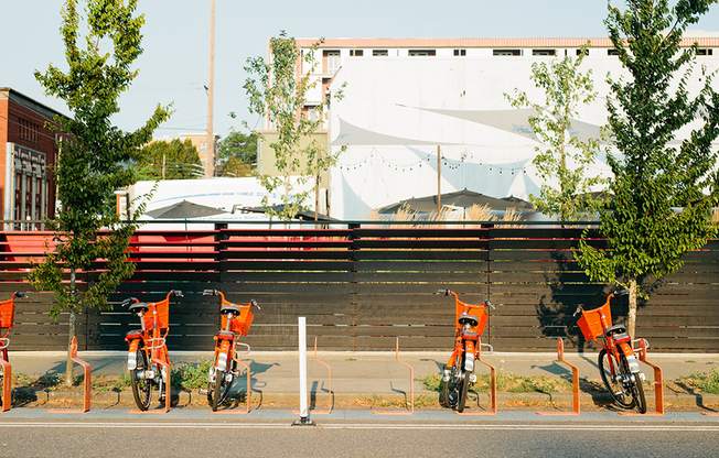 Bike rentals located outside Modera Buckman apartments in East Portland