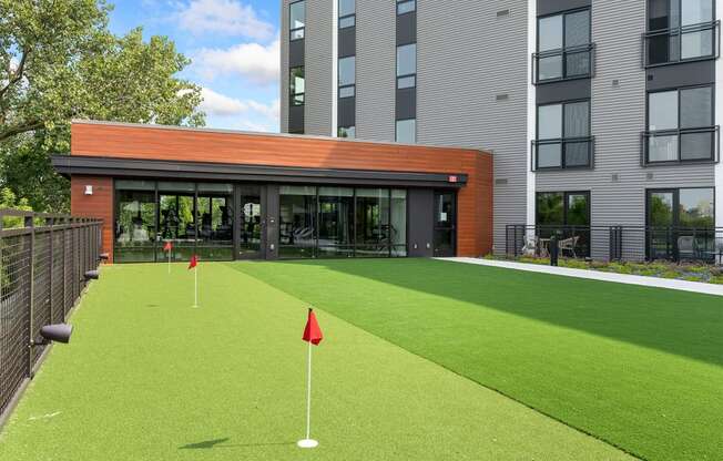 a putting green in front of a building