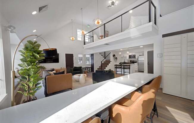 A modern dining area with a long table and chairs.