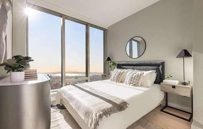 a bedroom with a large window and a bed at The Paxton, Brooklyn, NY 11201