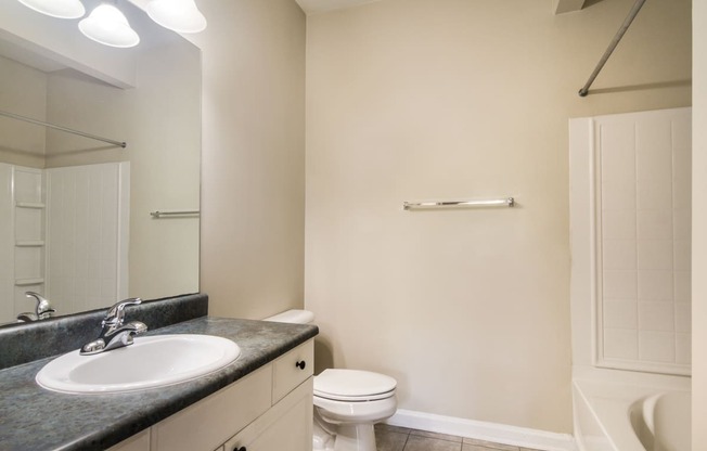 Clean and modern bathroom with essential amenities at Angel Landing apartments in Pensacola, FL